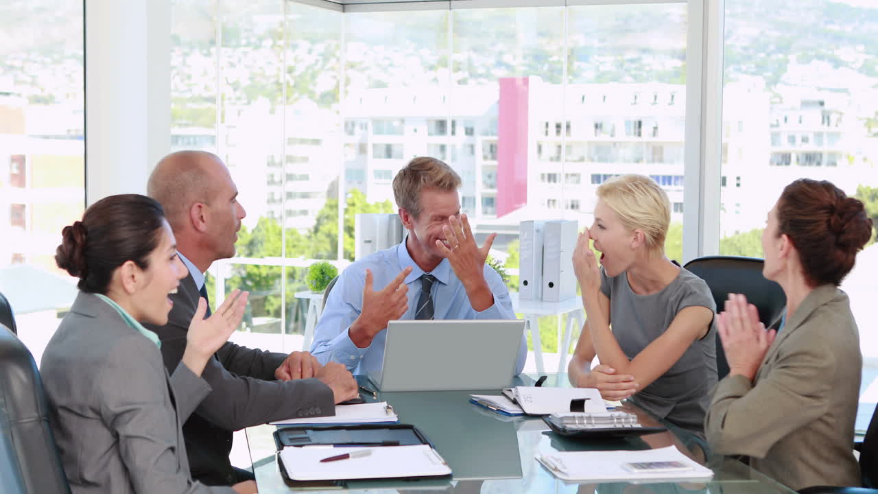 Business people speaking together during meeting 
