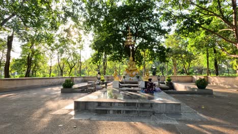 visitors at a serene outdoor shrine with offerings