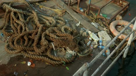 a pile of nautical rope and trash on the ground