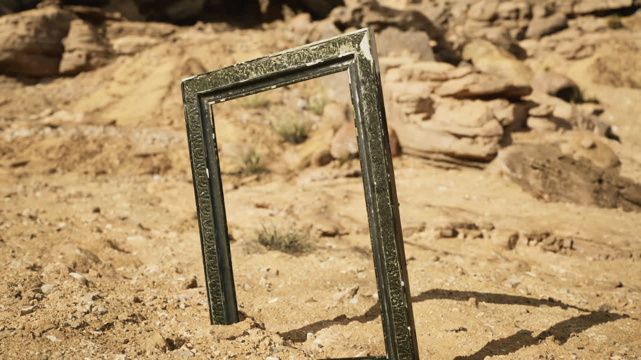 Artistic frame standing alone in a desert landscape under bright sunlight