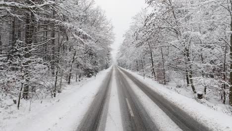 Aerial-view-of-a-snowy-road-in-northern-germany