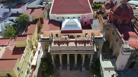 bird's eye aerial view of teatro juarez, sunny day, crane up