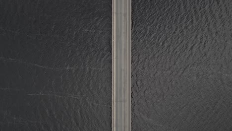 top view of cars driving on the bridge across blessington lake in county wicklow, ireland