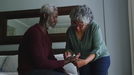 A-senior-African-american-couple-spending-time-together-at-home.-Social-distancing-in-quarantine.