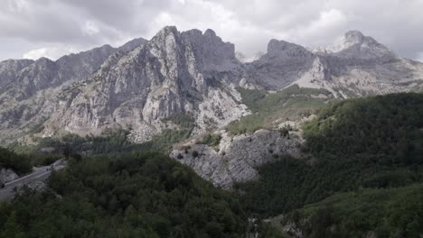 Frontal-plane-drone-video-moving-over-Sh-21-in-albania-with-Mount-Korab-in-front-as-the-main-shot