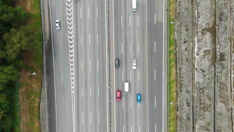 aerial: highway with cars and traffic during the day in petaling jaya, in the state of selangor, malaysia, top-down drone shot