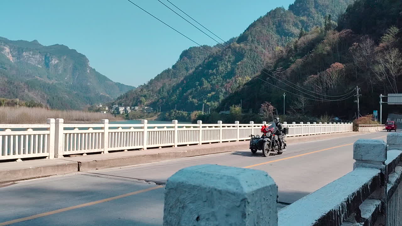 A tricycle passes by the bridge head