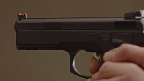 Close-up-of-9mm-handgun-barrel-while-being-fired