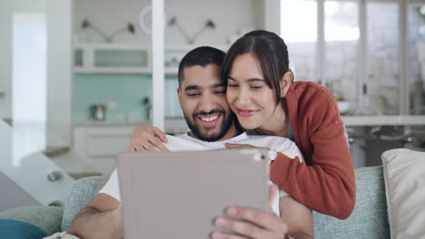 Young-happy-couple-browsing-online