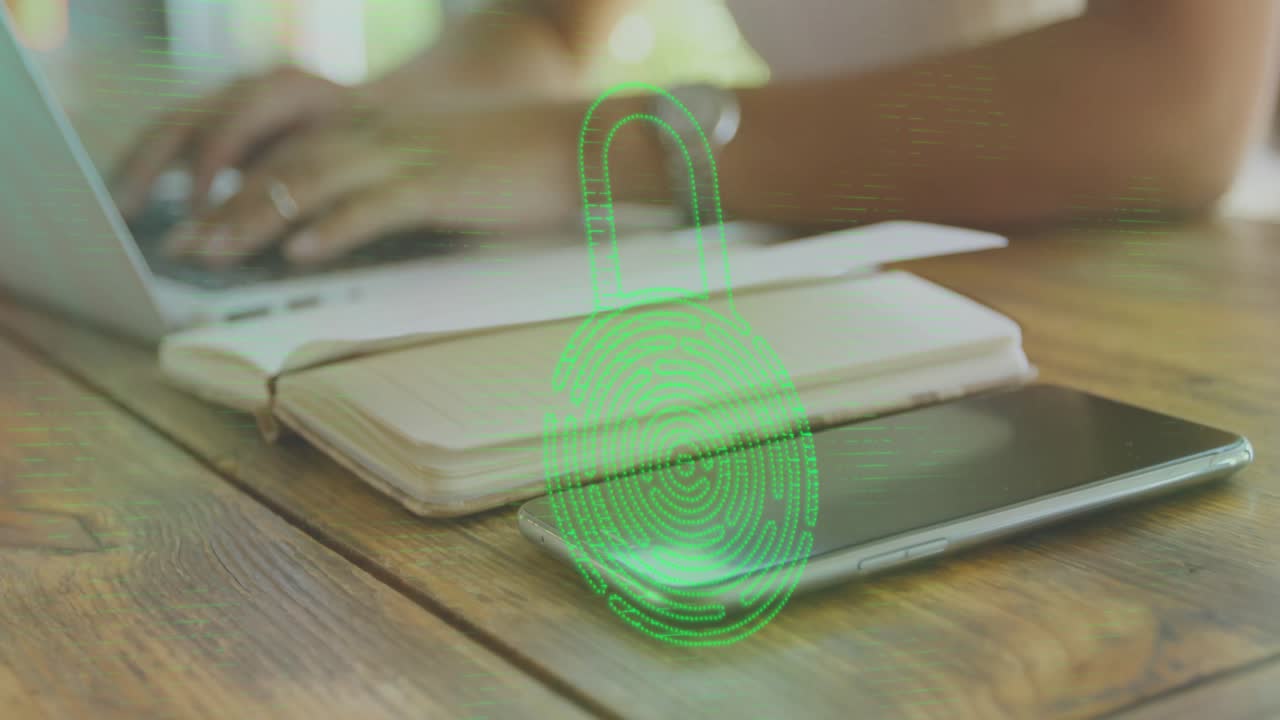 Technology user entering secure login on laptop while green padlock fading in on phone and notebook