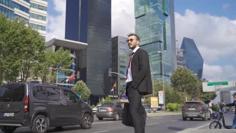 businessman standing near office building.