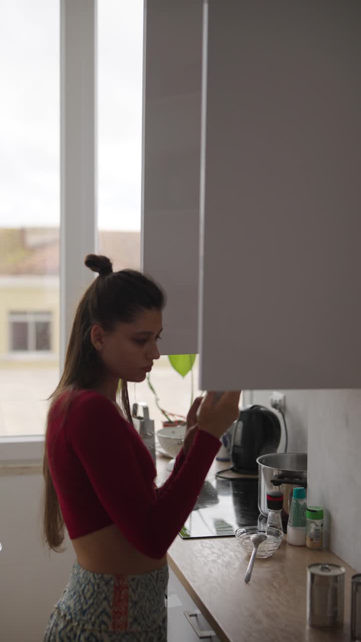 Woman in Kitchen Preparing Food
