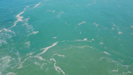 tranquil ocean scene of boats floating peacefully