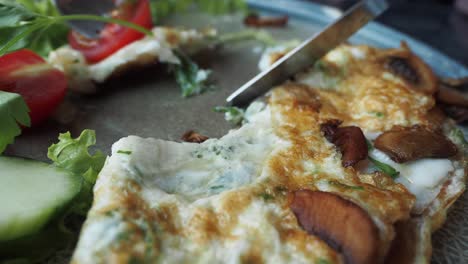 delicious mushroom and vegetable omelette with fresh salad