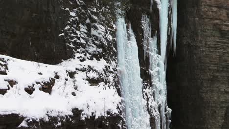 snow and ice covered waterfall cliff walls, ausable chasm, adirondacks, new york