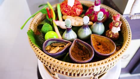 colorful spa ingredients arranged in a woven basket