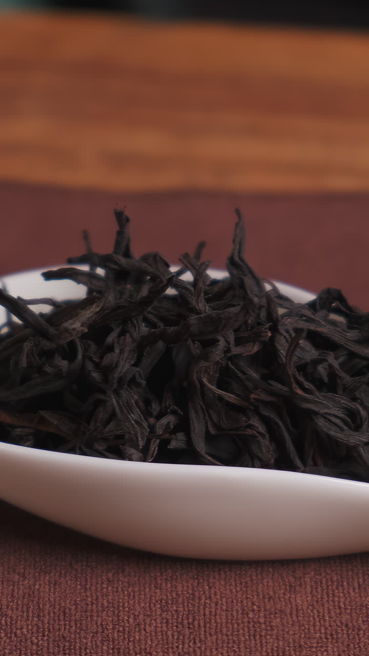 Black Tea in a White Spoon