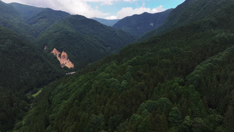 aerial ascending shot of the jigokudani valley, in the joshinetsu national park, summer in japan