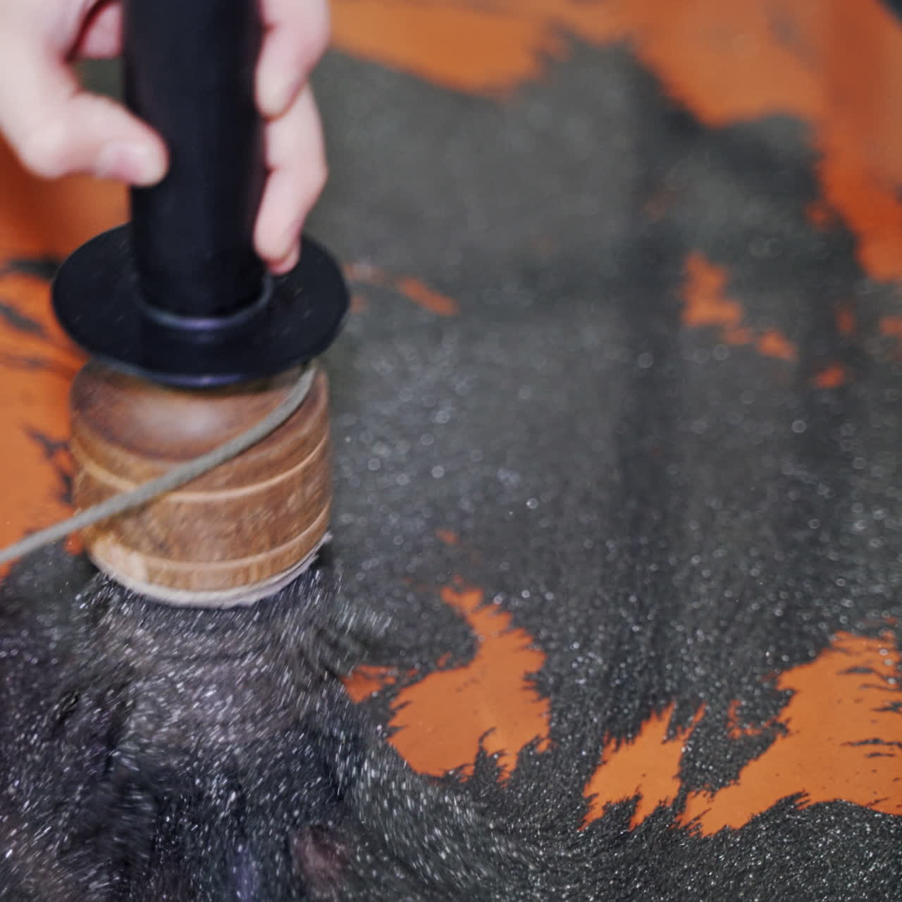 A boy plays at with Iron shavings and magnet at science activity centre. Science museum