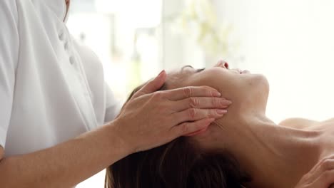 Close-up-of-therapist-massaging-the-head-of-her-patient