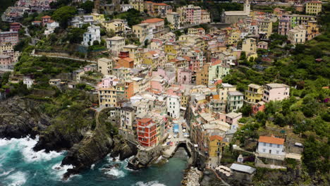 italian village of riomaggiore, high aerial view of coast