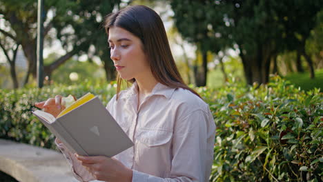 intelligent woman enjoy book sitting green park closeup. lady reading novel