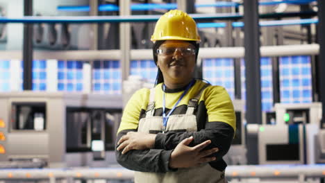 vertical video portrait of smiling technician in industrial plant working to diagnose equipment