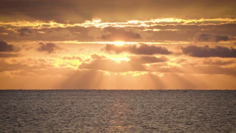 beautiful orange ocean sunrise with clouds and water