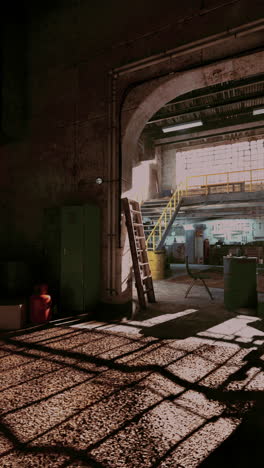 sunlight casting shadows in abandoned auto repair shop