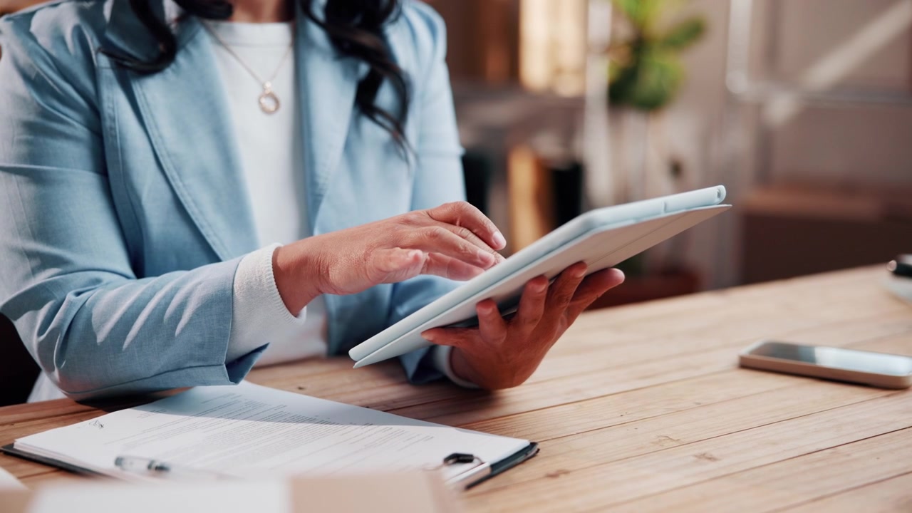 Professional Woman Using Digital Tablet at Office Desk