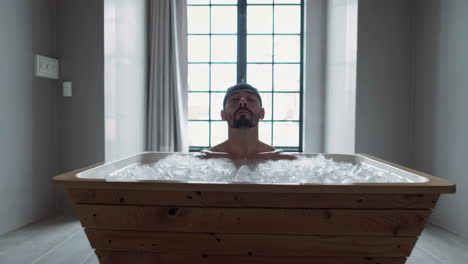 man enjoying a relaxing ice bath