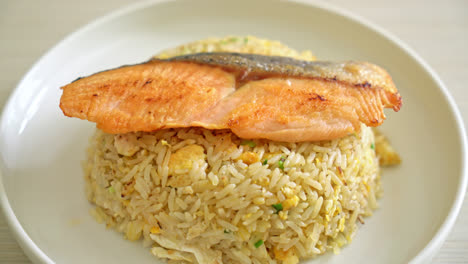 fried-rice-with-grilled-salmon-fillet-steak-on-white-plate