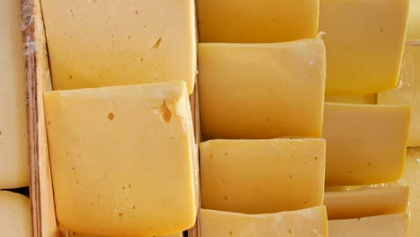 close up of a block of yellow cheese