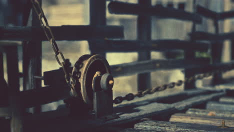 close-up of an old rusty pulley and chain mechanism