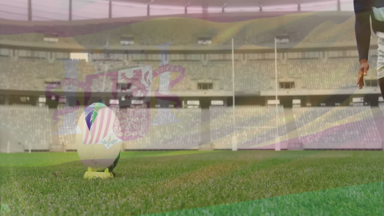 Rugby player preparing to kick ball on stadium field with crowd animation