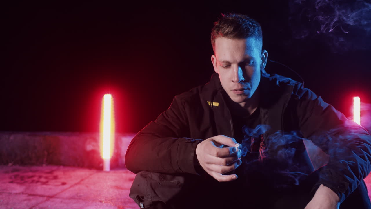 Man Smoking at Night