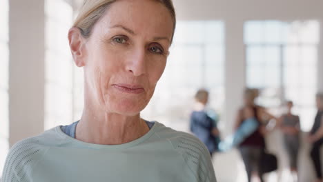 portrait happy old caucasian woman enjoying yoga class smiling cheerful middle aged female practicing healthy fitness lifestyle in workout studio