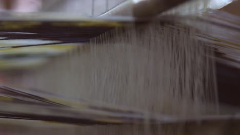 silk threads on a loom cu