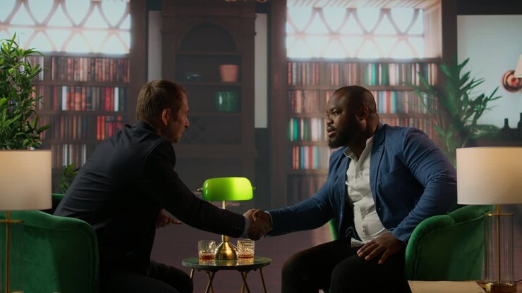 Diverse old money aristocrats shaking hands in agreement to unite their business