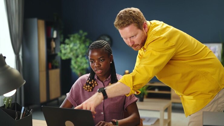 Colleagues Collaborating on a Project in a Modern Office