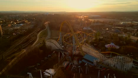 aerial drone view of amusement park during sunset