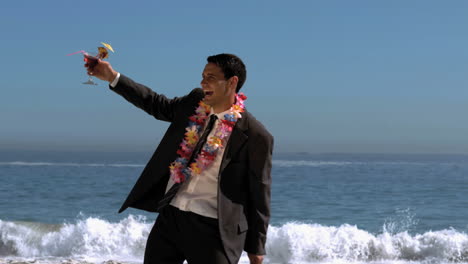 Attractive-businessman-dancing-on-the-beach