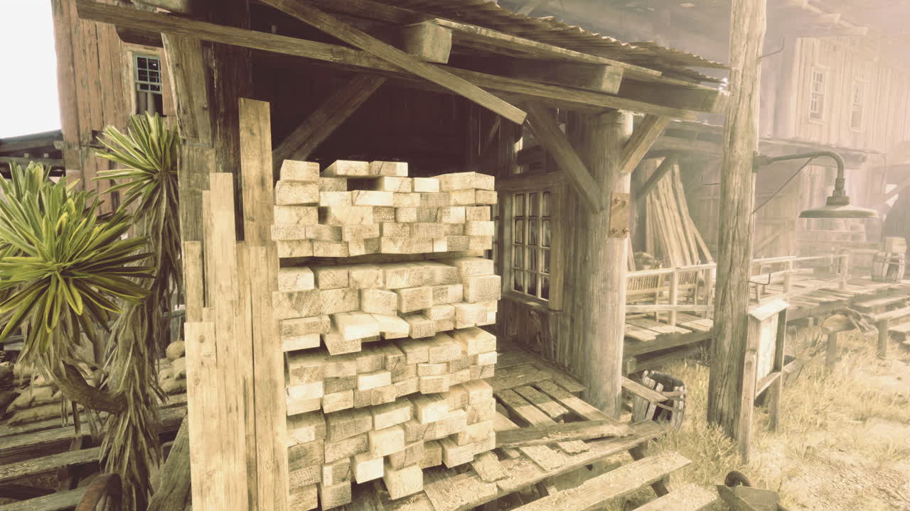 Rustic wooden structure with stacked lumber in a dusty environment