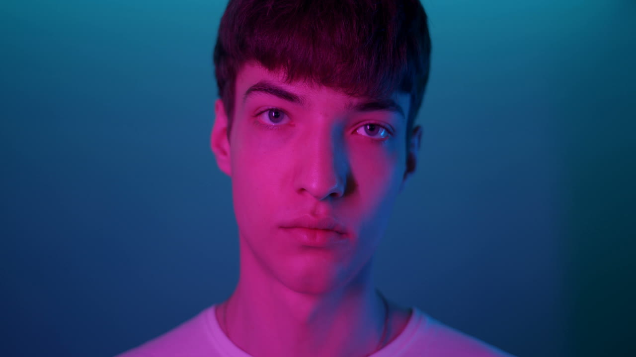Portrait of a Young Man in Blue and Pink Light