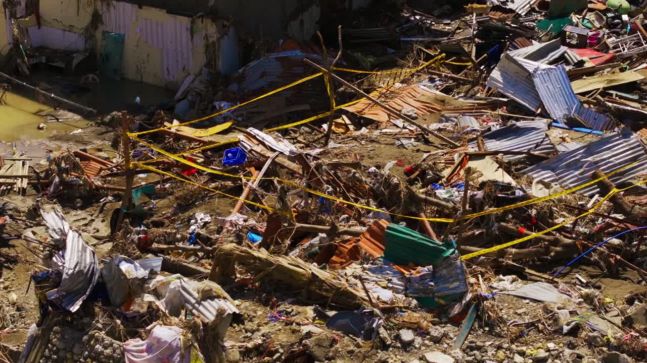 People secure flood damage site after typhoon in Talisay Cebu Philippines