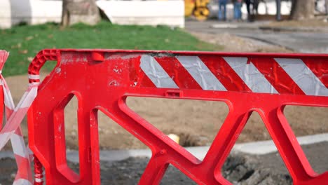 red and white construction barrier