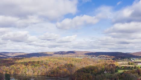 aerial timelapse, hyperlapse of colorful fall forest during autumn