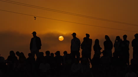 sunset gathering of people