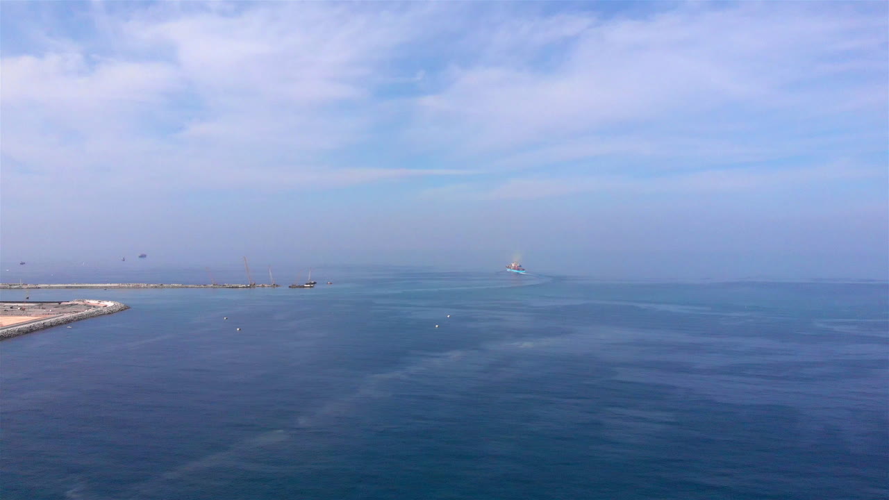 Aerial footage of Cargo Ship Leaving the port