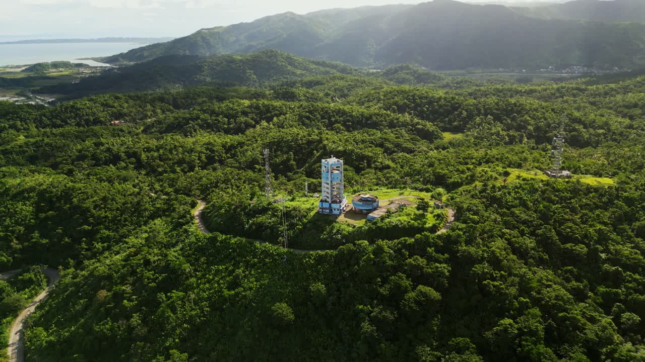 Dense Tropical Jungle Reveals PAGASA Virac Radar Station In Buenavista, Bato, Catanduanes, Philippines. Aerial Tilt-up Shot